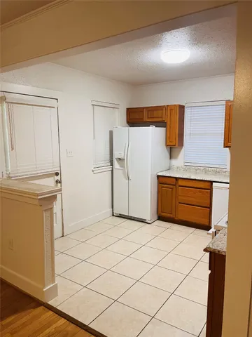 a kitchen with stainless steel appliances a refrigerator and a stove