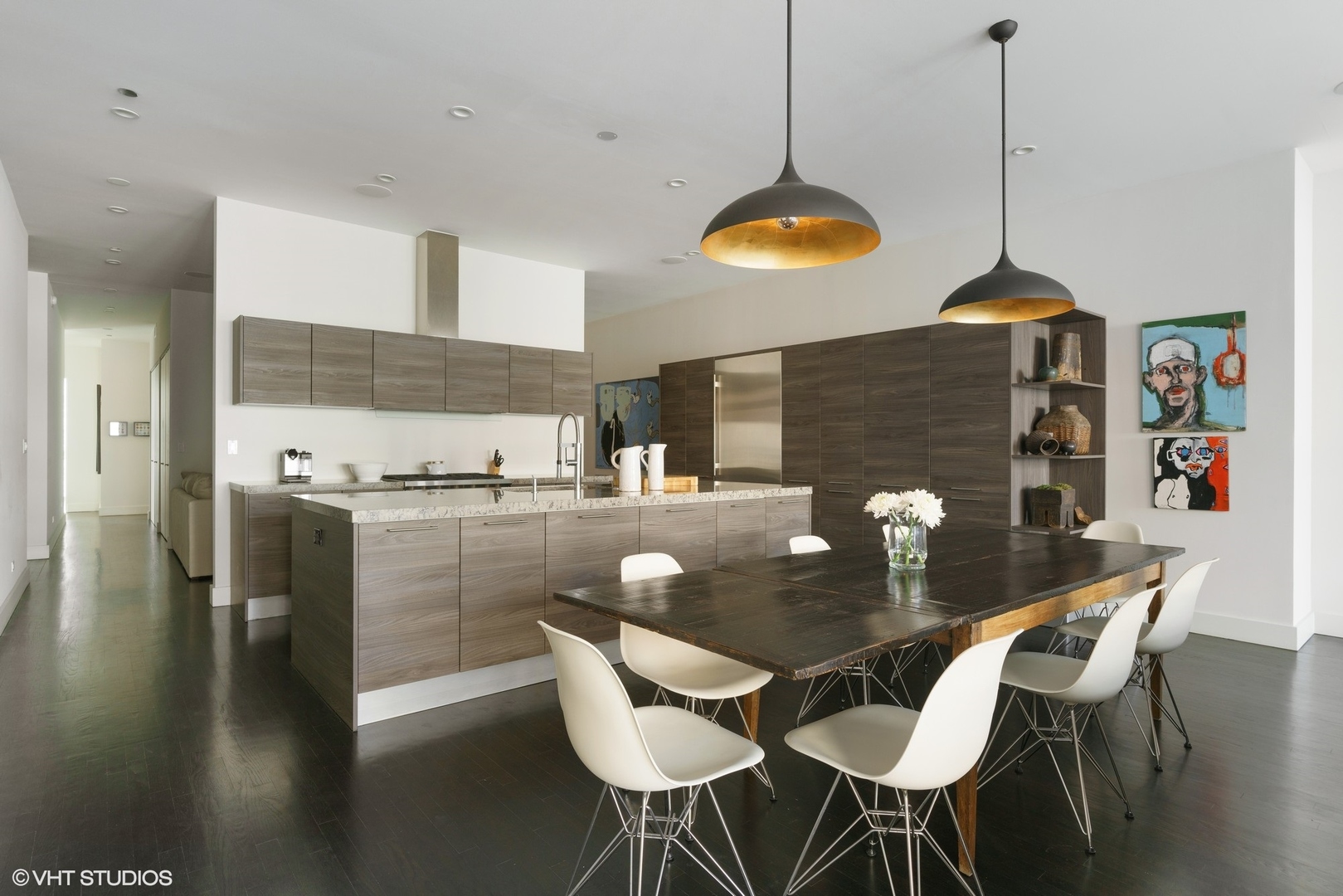 747 North Clark Street, Unit 201 Chicago, IL 60654 - Photo 12 of 30 a kitchen with stainless steel appliances granite countertop a dining table chairs and a stove