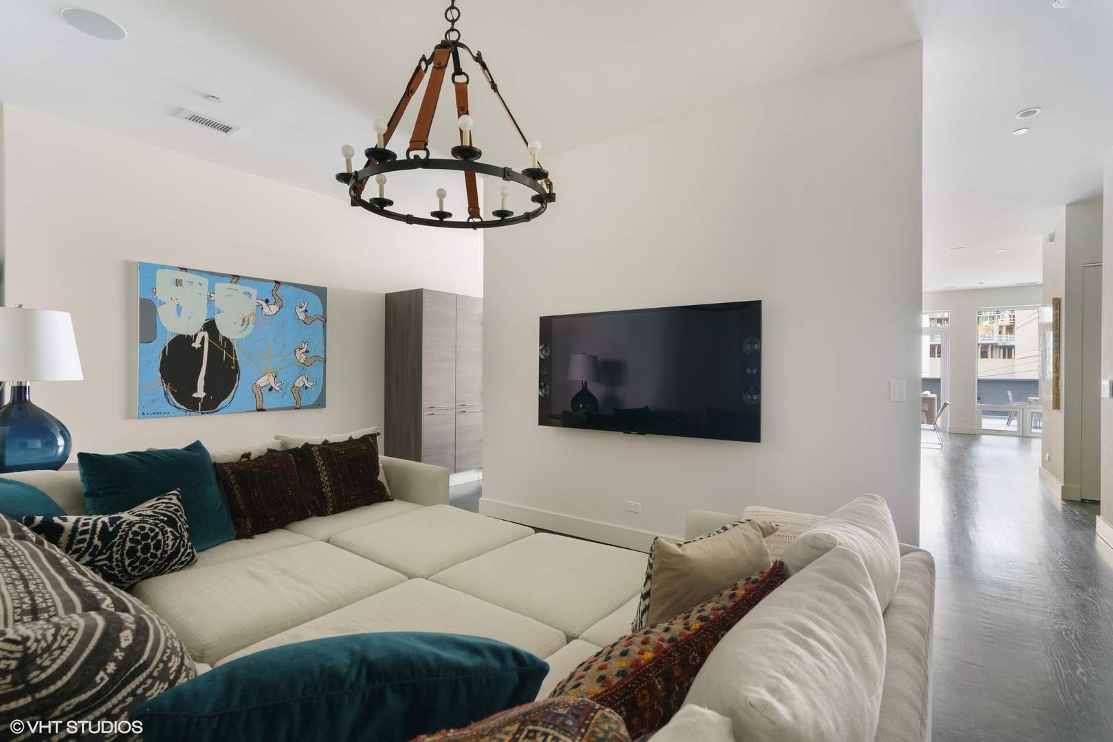 747 North Clark Street, Unit 201 Chicago, IL 60654 - Photo 13 of 30 a bedroom with a bed and a flat screen tv