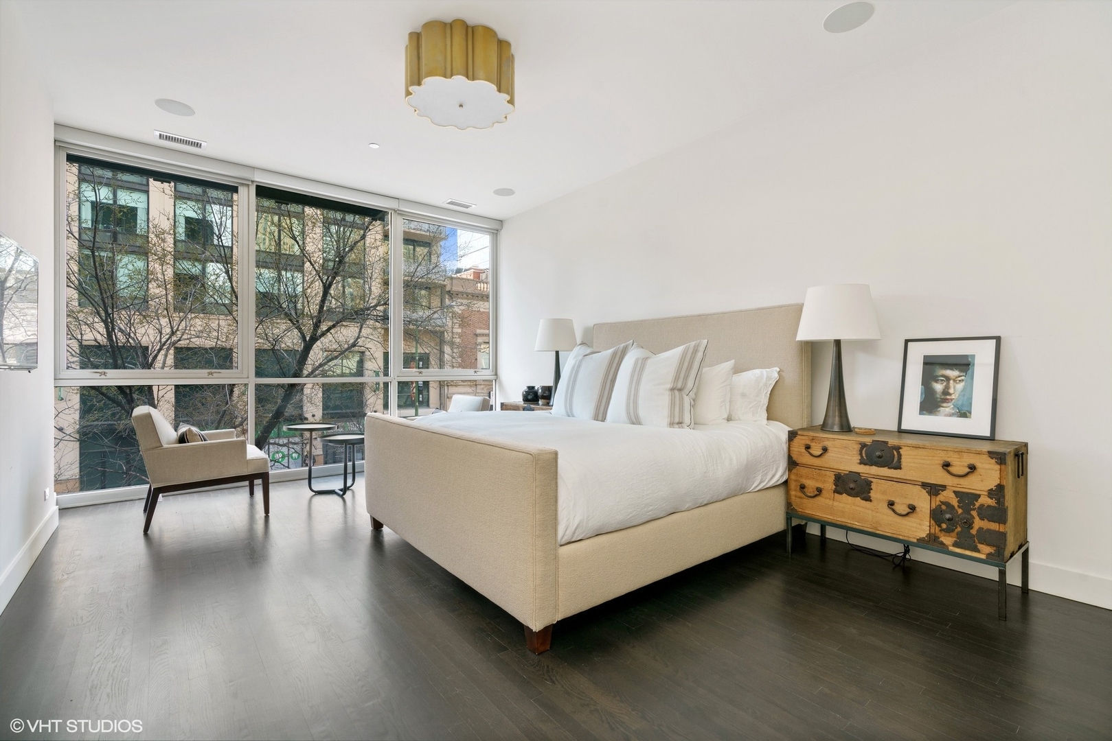 747 North Clark Street, Unit 201 Chicago, IL 60654 - Photo 16 of 30 a bedroom with a bed and a large window