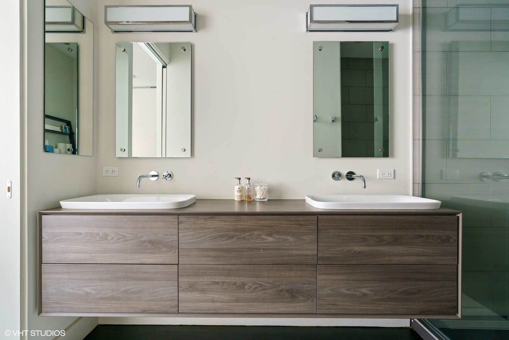 747 North Clark Street, Unit 201 Chicago, IL 60654 - Photo 20 of 30 a bathroom with a sink and a mirror
