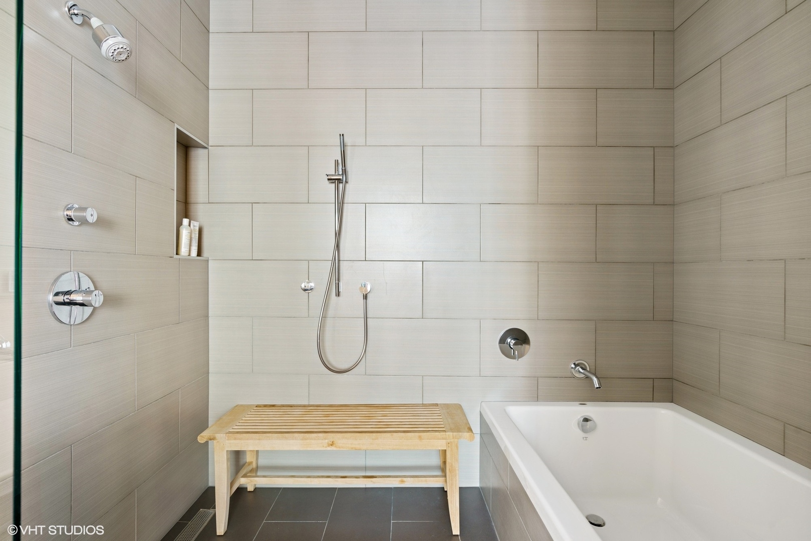 747 North Clark Street, Unit 201 Chicago, IL 60654 - Photo 21 of 30 a bathroom with a tub a toilet and a shower