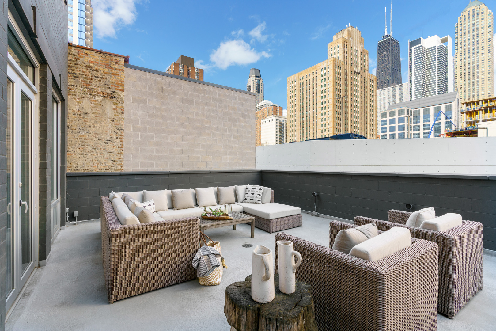 747 North Clark Street, Unit 201 Chicago, IL 60654 - Photo 30 of 30 a roof deck view with couches and potted plants