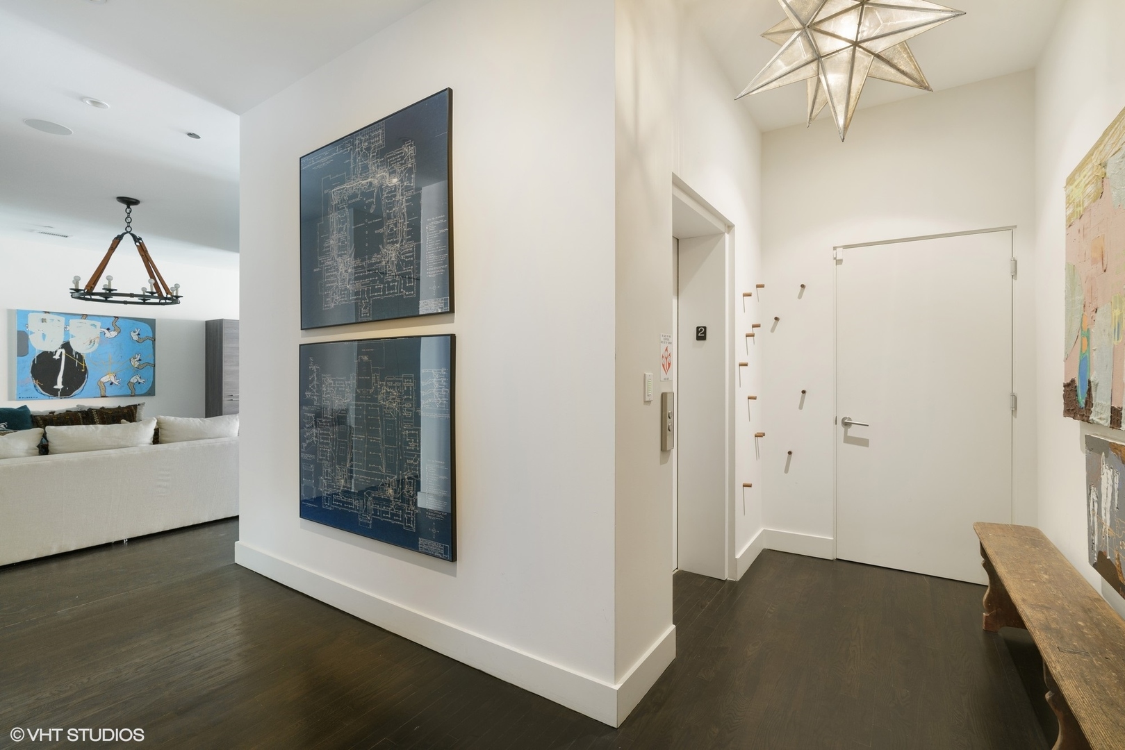 747 North Clark Street, Unit 201 Chicago, IL 60654 - Photo 3 of 30 a view of a hallway view with wooden floor and staircase