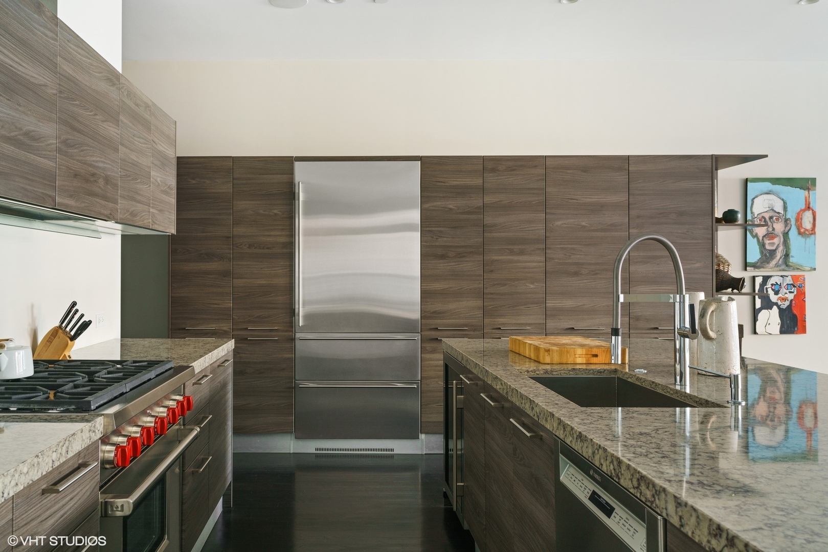 747 North Clark Street, Unit 201 Chicago, IL 60654 - Photo 7 of 30 a kitchen with stainless steel appliances granite countertop a sink and a stove