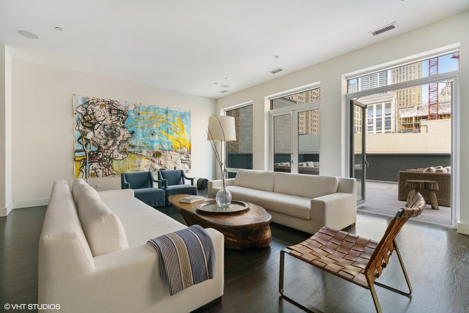 747 North Clark Street, Unit 201 Chicago, IL 60654 - Photo 8 of 30 a living room with furniture and a large window