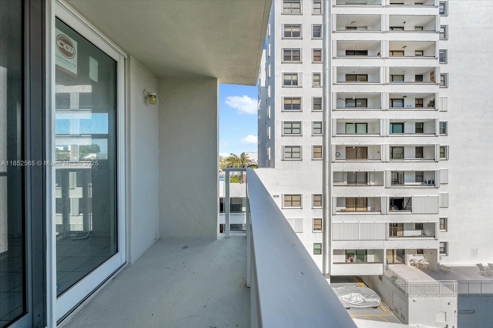 1750 James Avenue, Unit 7L Miami Beach, FL 33139 - Photo 15 of 27 a view of a large building with wooden floor and windows