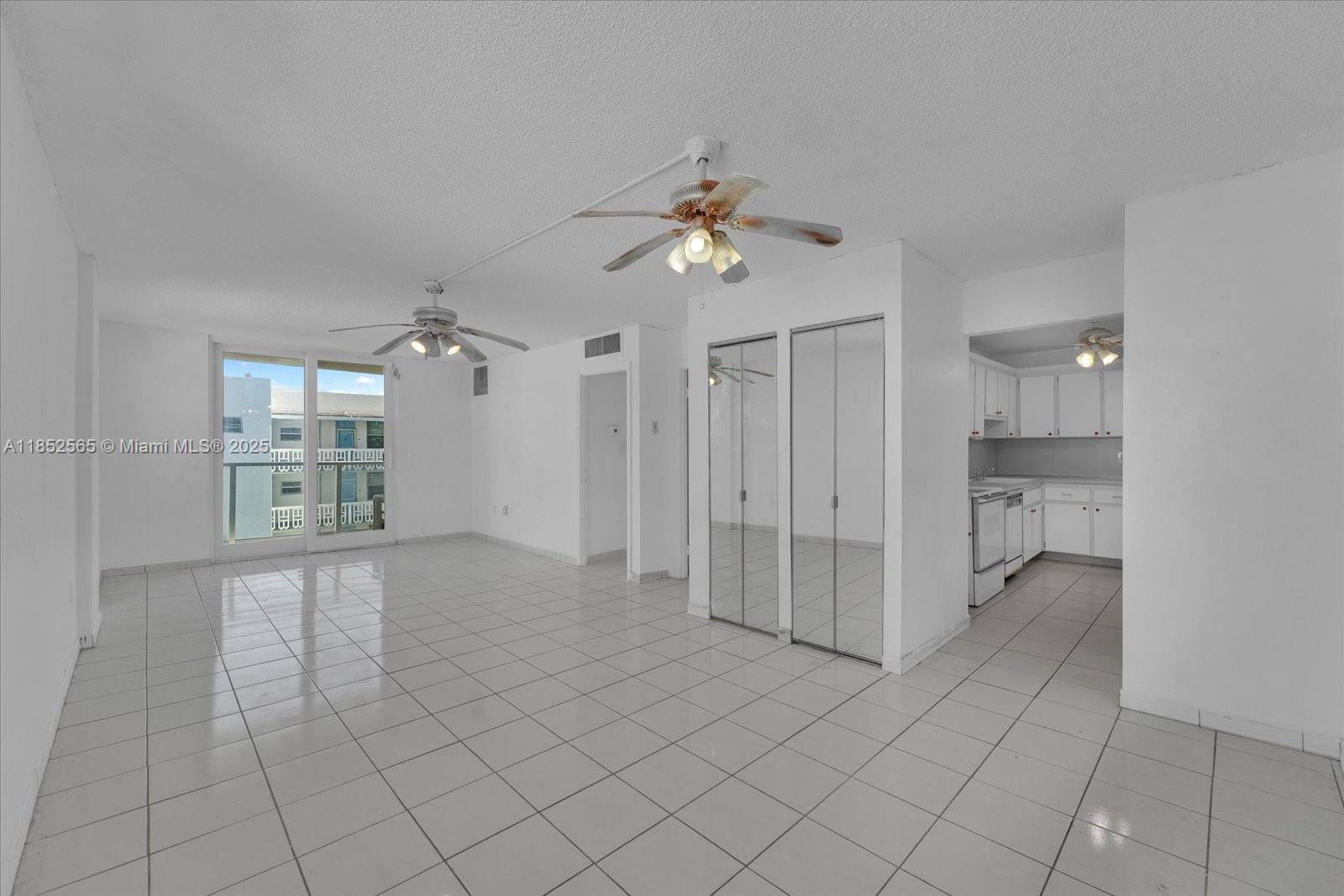 1750 James Avenue, Unit 7L Miami Beach, FL 33139 - Photo 2 of 27 a view of an empty room with a window