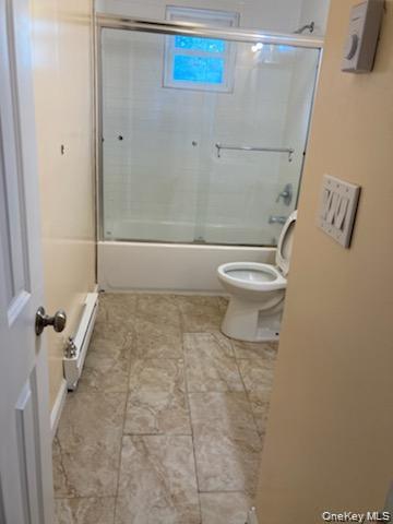 1455 East Forks Road Bay Shore, NY 11706 - Photo 7 of 7 a bathroom with a toilet and a shower