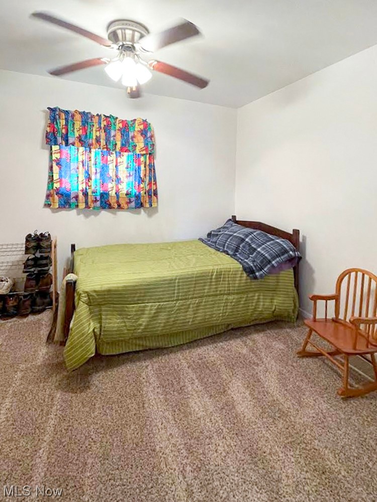 832 Cross Creek Road Colliers, WV 26035 - Photo 14 of 22 Bedroom with ceiling fan and carpet flooring