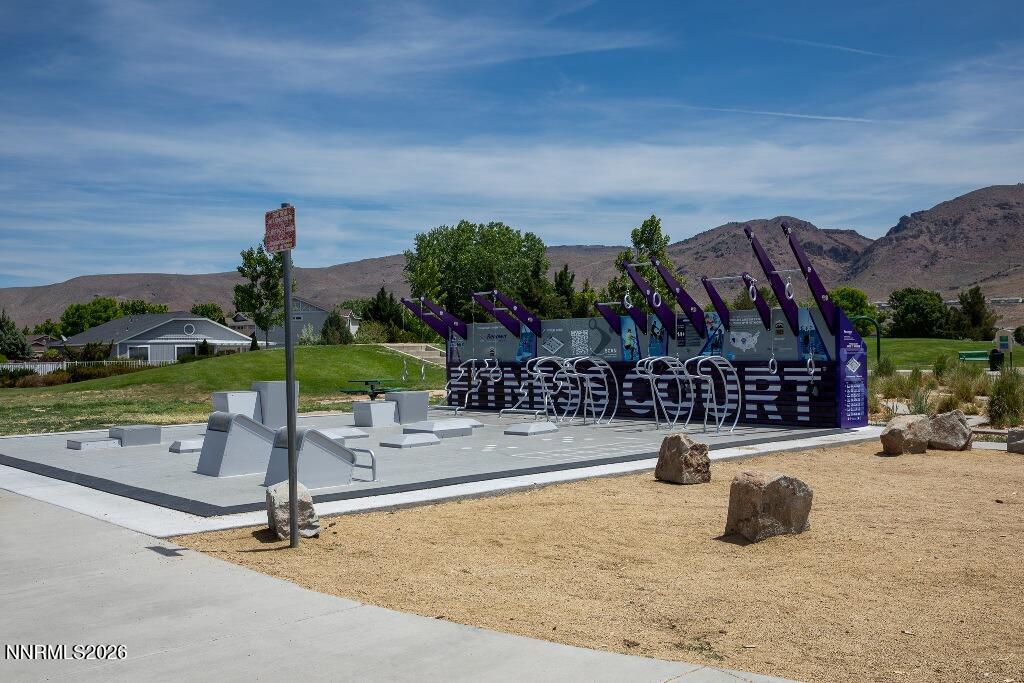 1864 Wind Ranch Road, Unit B Reno, NV 89521 - Photo 40 of 42 a wooden bench sitting in front of a building