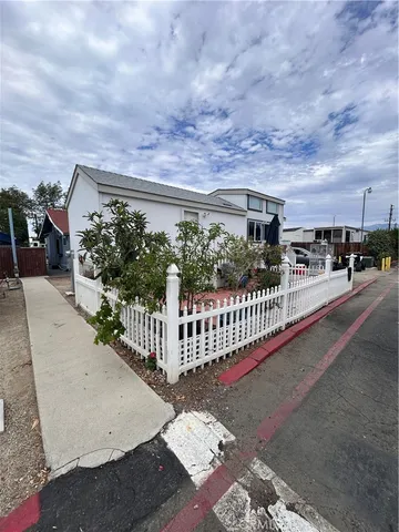 a view of a porch with wooden fence