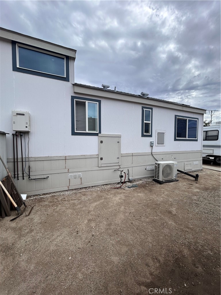 1409 Redlands Boulevard, Unit 27 Redlands, CA 92373 - Photo 4 of 15 a view of a house with backyard