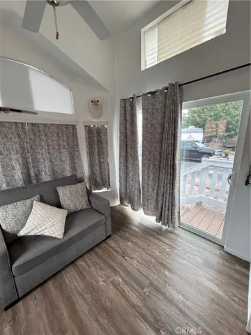 a kitchen with granite countertop a stove and a microwave with wooden floor