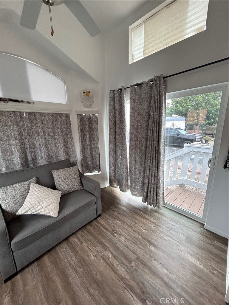 1409 Redlands Boulevard, Unit 27 Redlands, CA 92373 - Photo 9 of 15 a living room with furniture and wooden floor