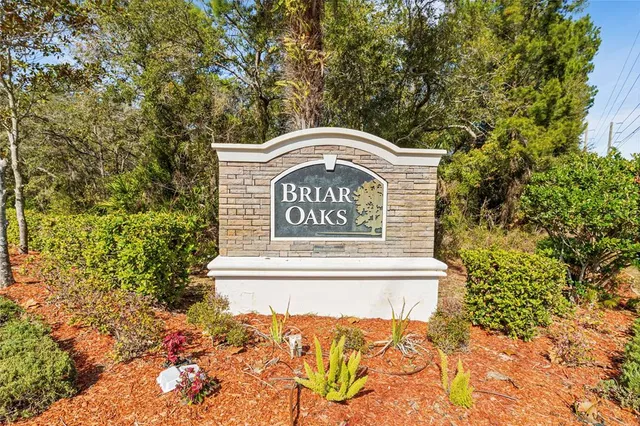 a view of outdoor space with signage and flags