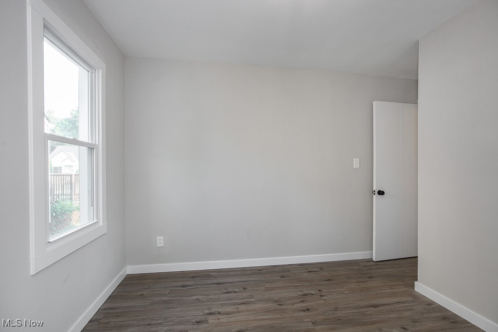 5607 Ridgewood Avenue Parma, OH 44129 - Photo 14 of 23 Unfurnished room with dark wood-type flooring