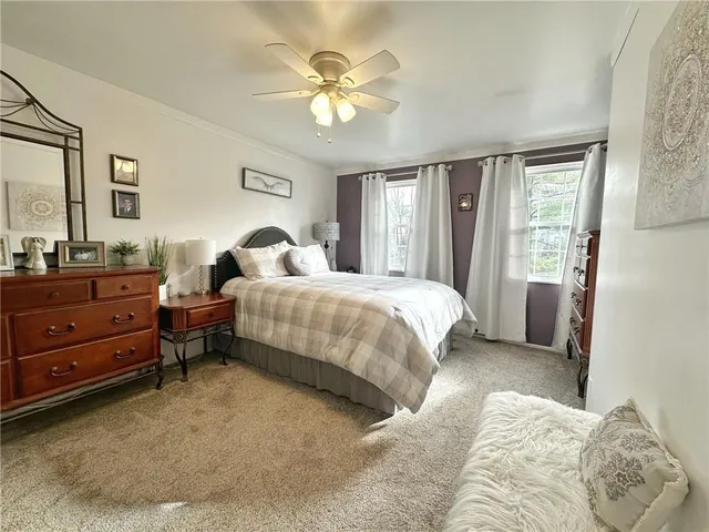 a bedroom with a bed and window