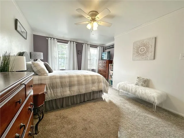 a bedroom with a bed and window