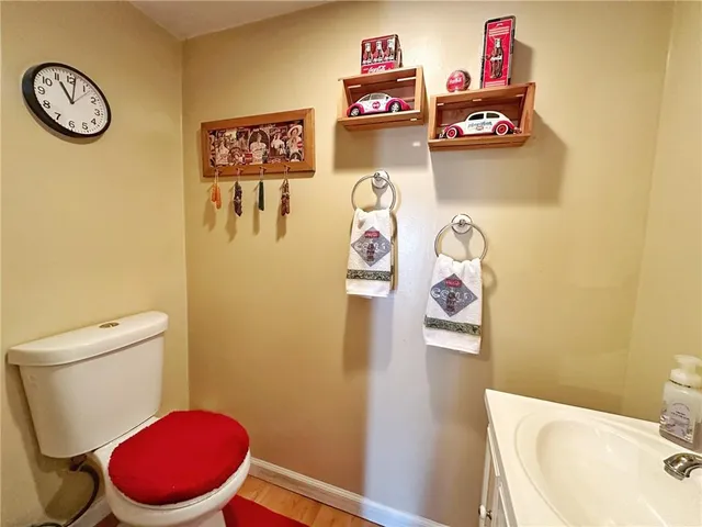 a bathroom with a toilet and a shower curtain