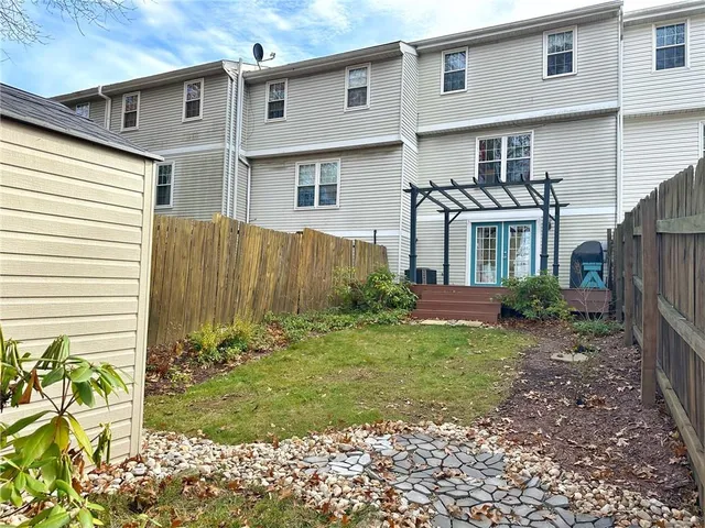 a view of a back yard of the house