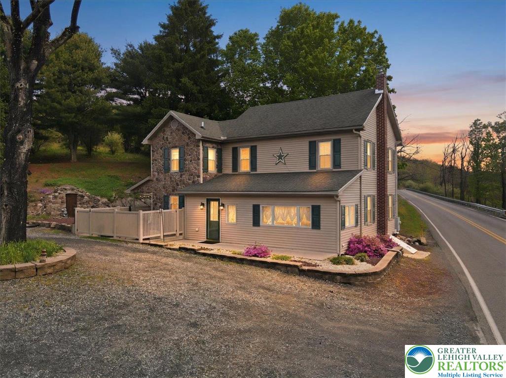 4880 Little Gap Road Kunkletown, PA 18058 - Photo 2 of 100 This charming home offers a perfect blend of natural surroundings and classic residential architecture.