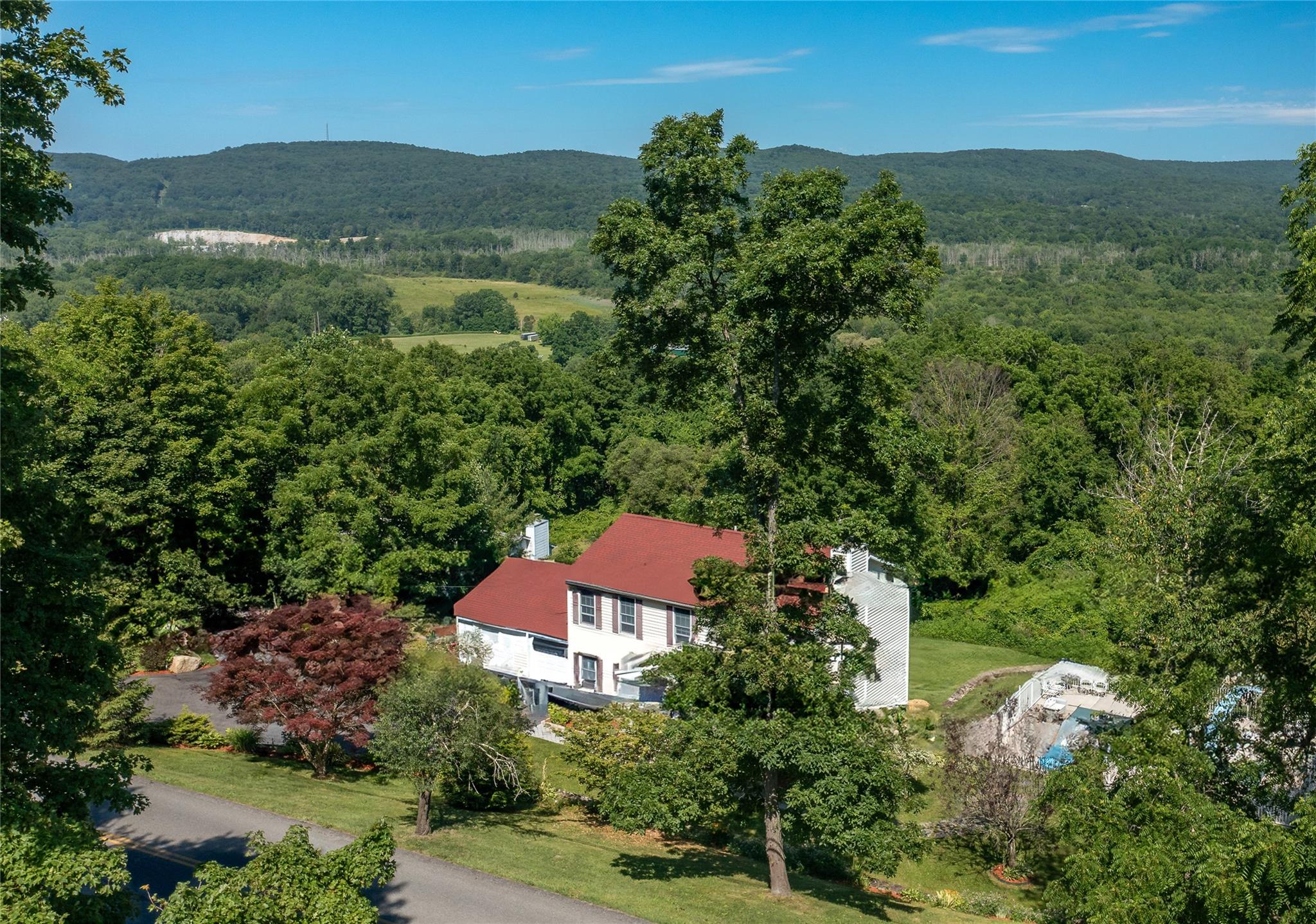 135 South Quaker Hill Road Patterson, NY 12563 - Photo 1 of 1 an aerial view of residential house with outdoor space and street view
