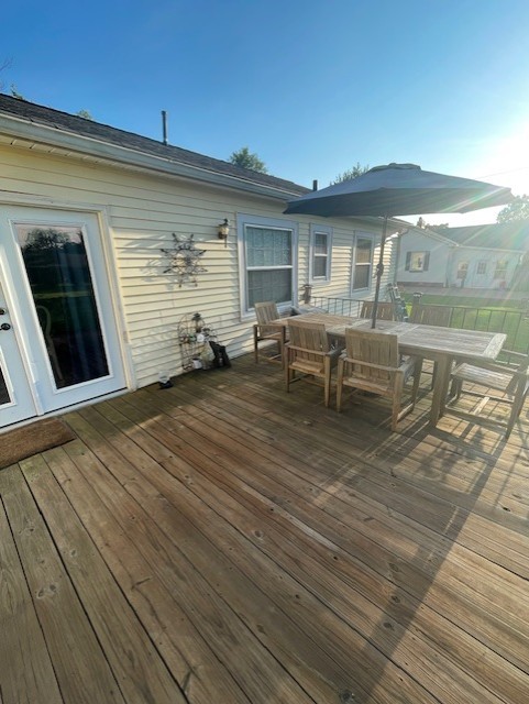 616 1st Street Lawrenceburg, TN 38464 - Photo 17 of 49 a view of a patio with table and chairs with wooden floor and fence
