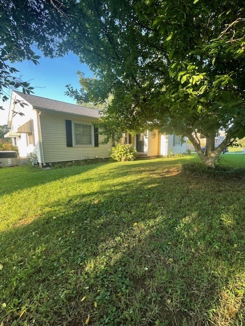 616 1st Street Lawrenceburg, TN 38464 - Photo 2 of 49 a view of a yard in front of the house