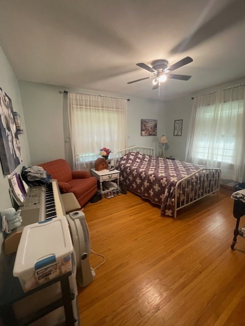 616 1st Street Lawrenceburg, TN 38464 - Photo 31 of 49 a bedroom with two beds and a chandelier