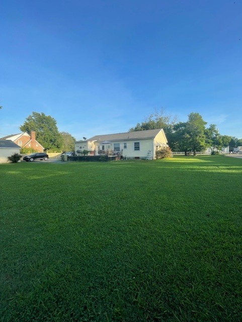 616 1st Street Lawrenceburg, TN 38464 - Photo 9 of 49 a view of a green field with clear sky