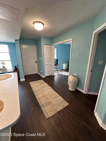 a view of kitchen and wooden floor