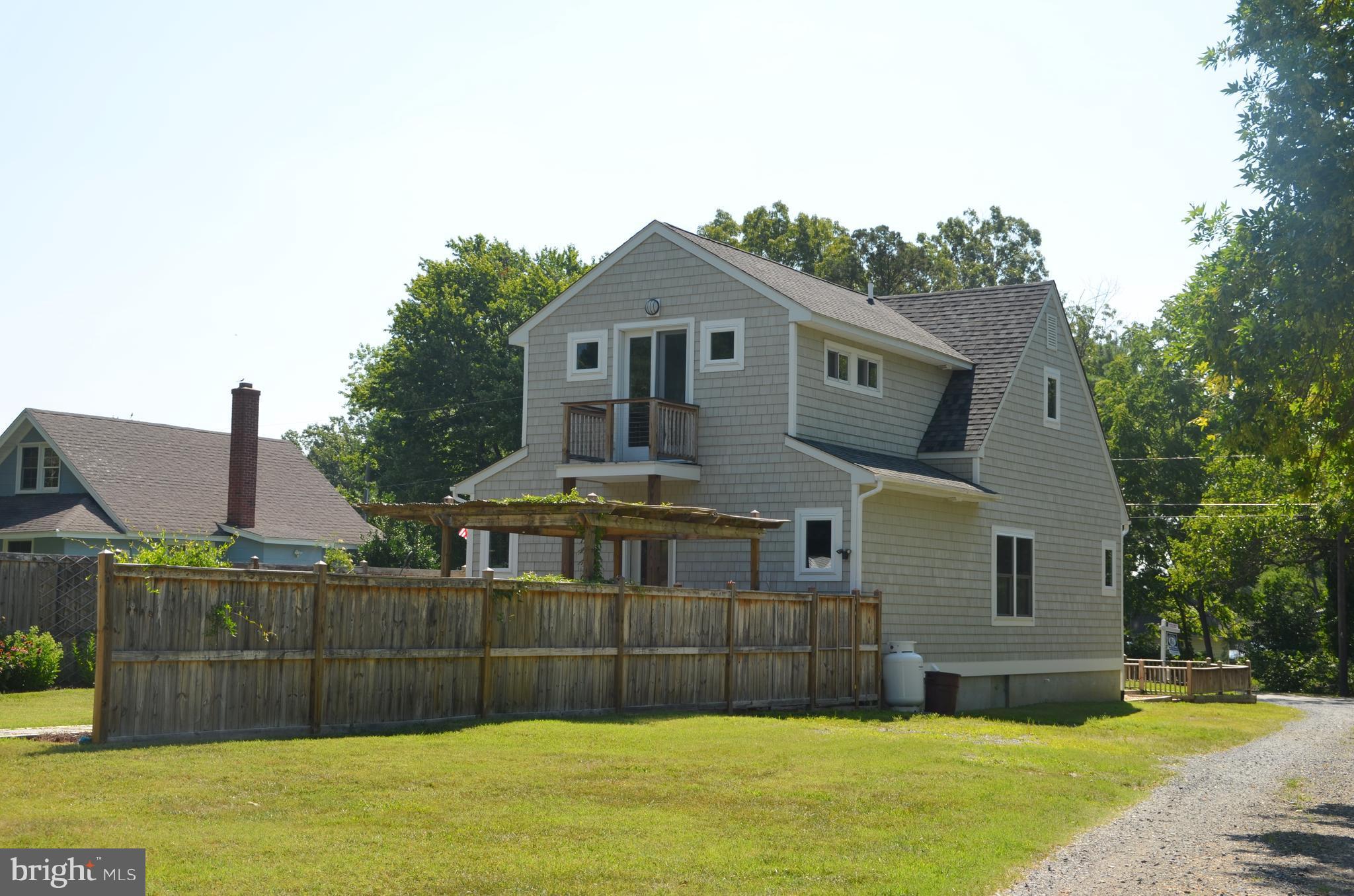 7370 Station Road Newcomb, MD 21653 - Photo 2 of 30 a front view of house with a garden
