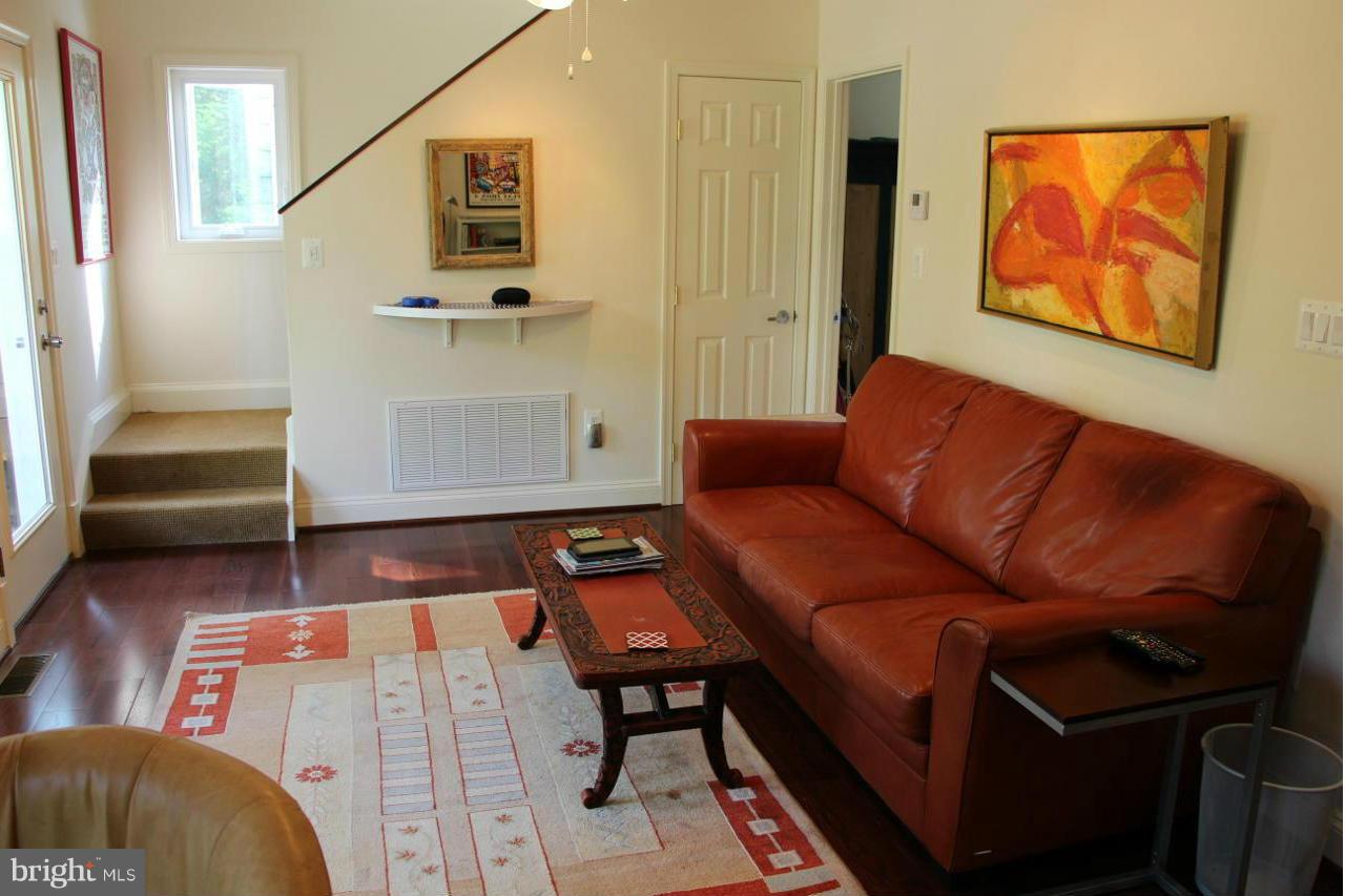 7370 Station Road Newcomb, MD 21653 - Photo 13 of 30 a living room with furniture and a wooden floor