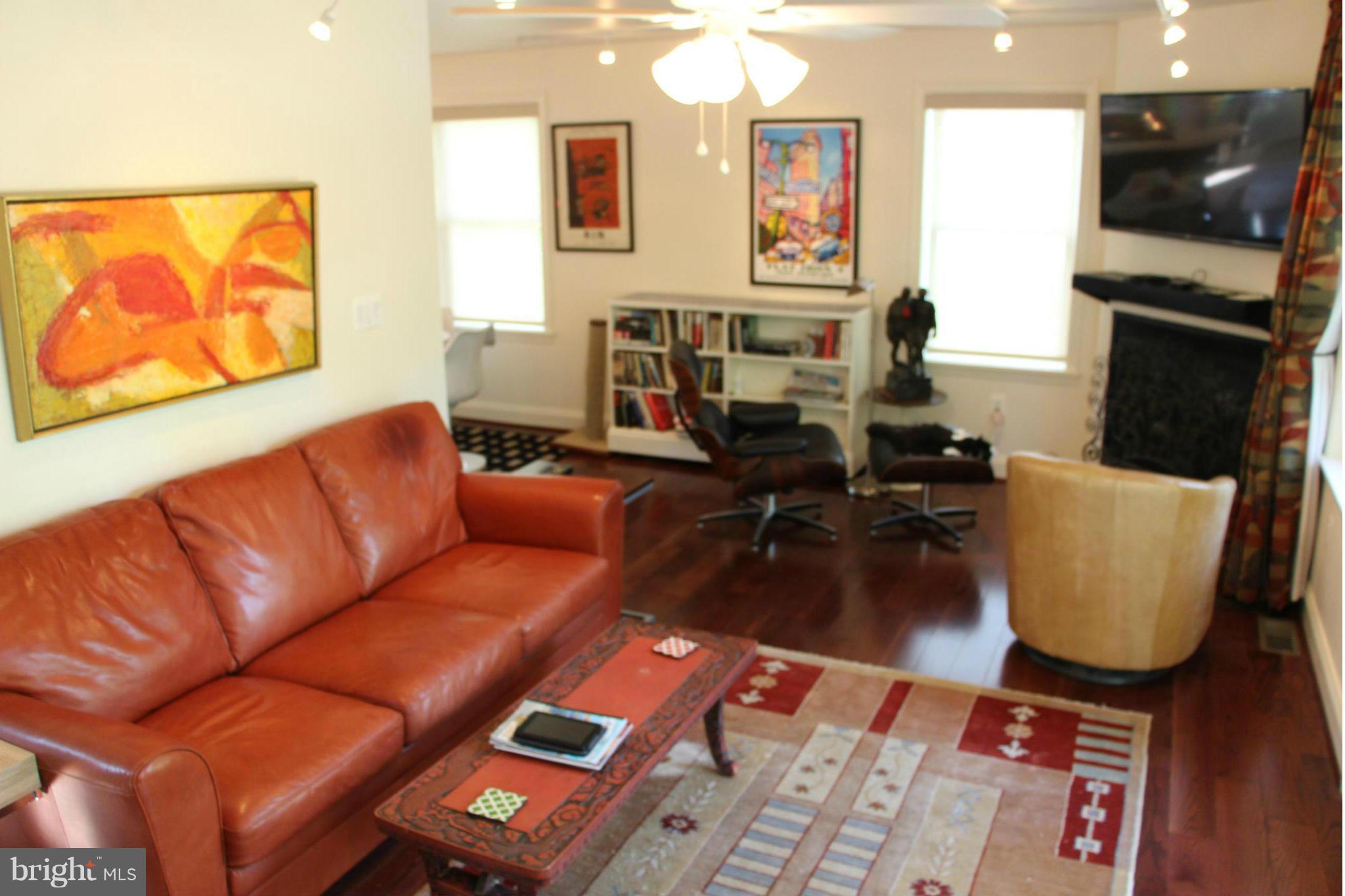 7370 Station Road Newcomb, MD 21653 - Photo 14 of 30 a living room with furniture fireplace and flat screen tv