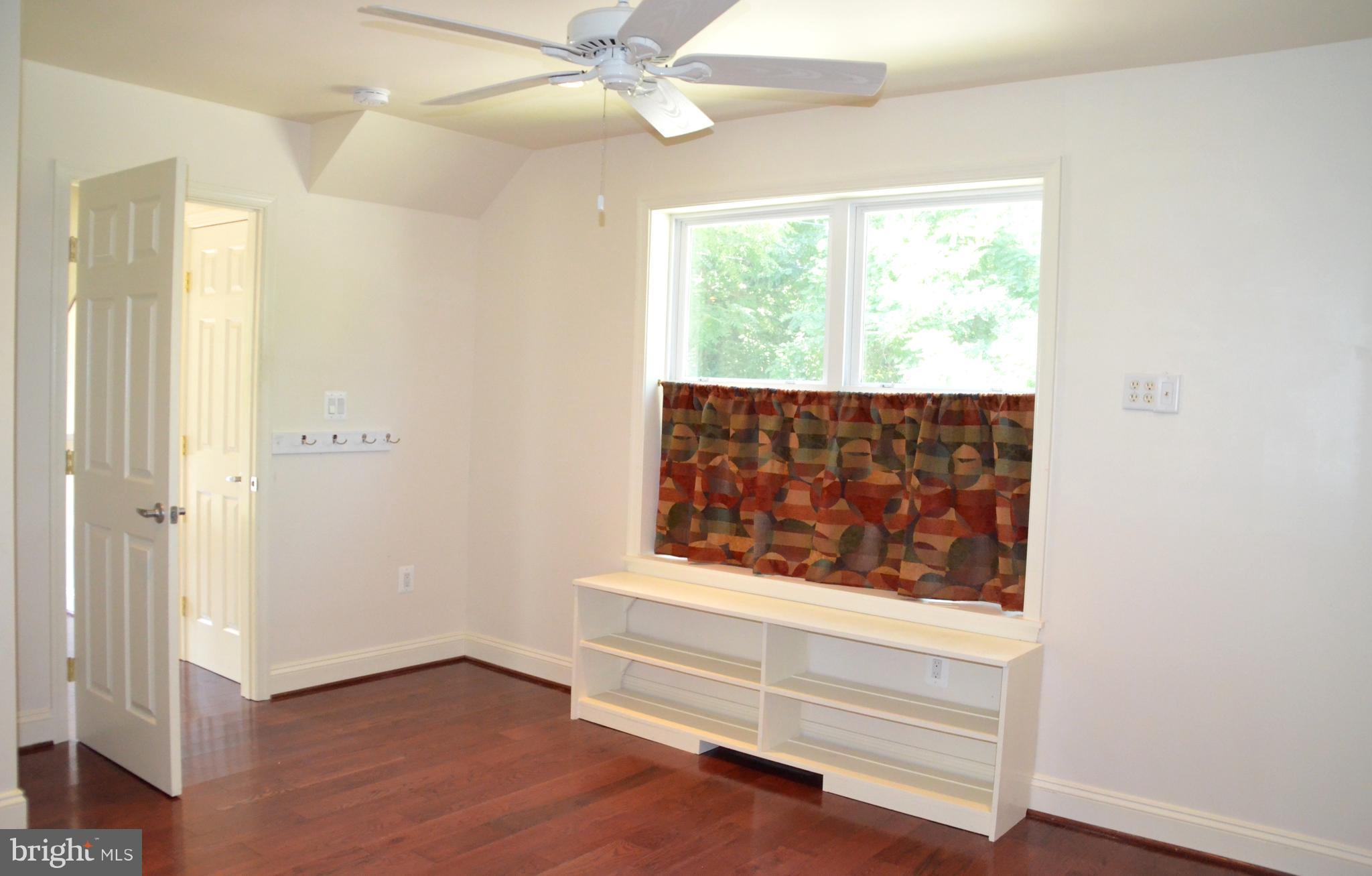 7370 Station Road Newcomb, MD 21653 - Photo 15 of 30 a view of front door with wooden floor