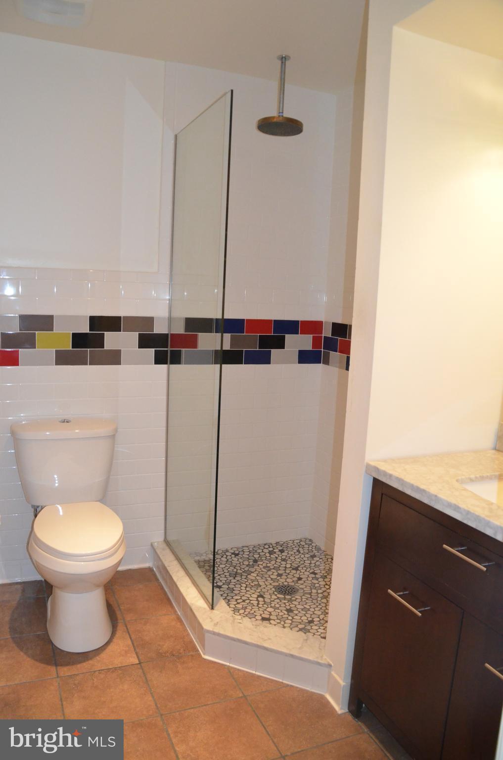 7370 Station Road Newcomb, MD 21653 - Photo 16 of 30 a bathroom with a toilet and a shower