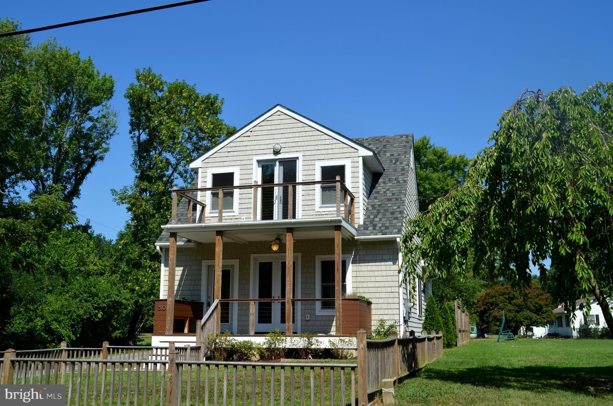 7370 Station Road Newcomb, MD 21653 - Photo 25 of 30 front view of a house with a yard
