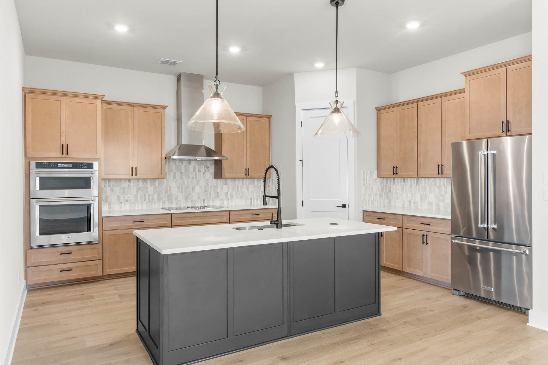 305 Kanarra Crk Road Jarrell, TX 76537 - Photo 2 of 11 At the center of the Kingsley is a spacious kitchen complete with a large pantry.