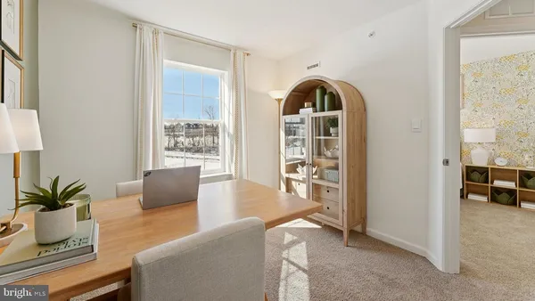 a view of livingroom with furniture and a potted plant