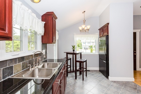 72 Ferry Road Salisbury, MA 01952 - Photo 6 of 30 a kitchen with a table chairs and entryway