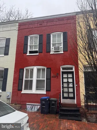 a red brick building that has lot of windows on it