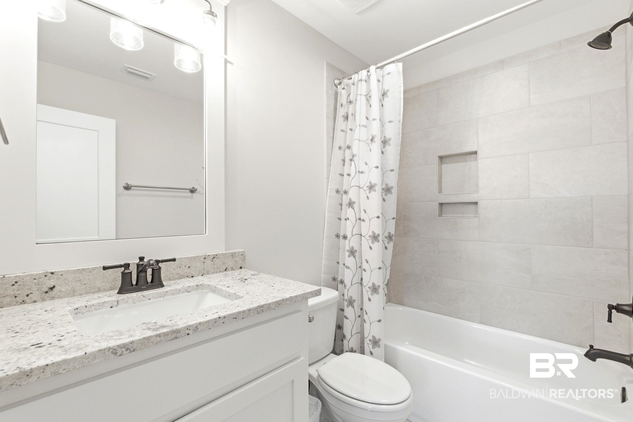 12132 Exbury Way Daphne, AL 36527 - Photo 30 of 47 Full bathroom featuring vanity and shower / bath combo