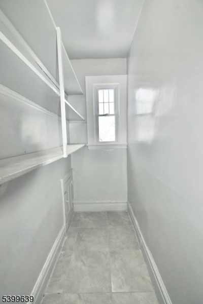 519 Clinton Place, Unit 2R Newark, NJ 07112 - Photo 14 of 14 an empty room with windows