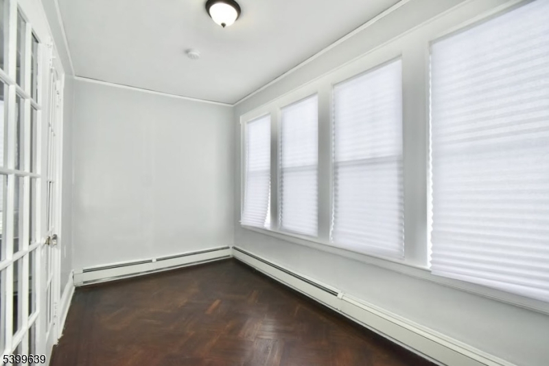 519 Clinton Place, Unit 2R Newark, NJ 07112 - Photo 4 of 14 a view of an empty room with a window
