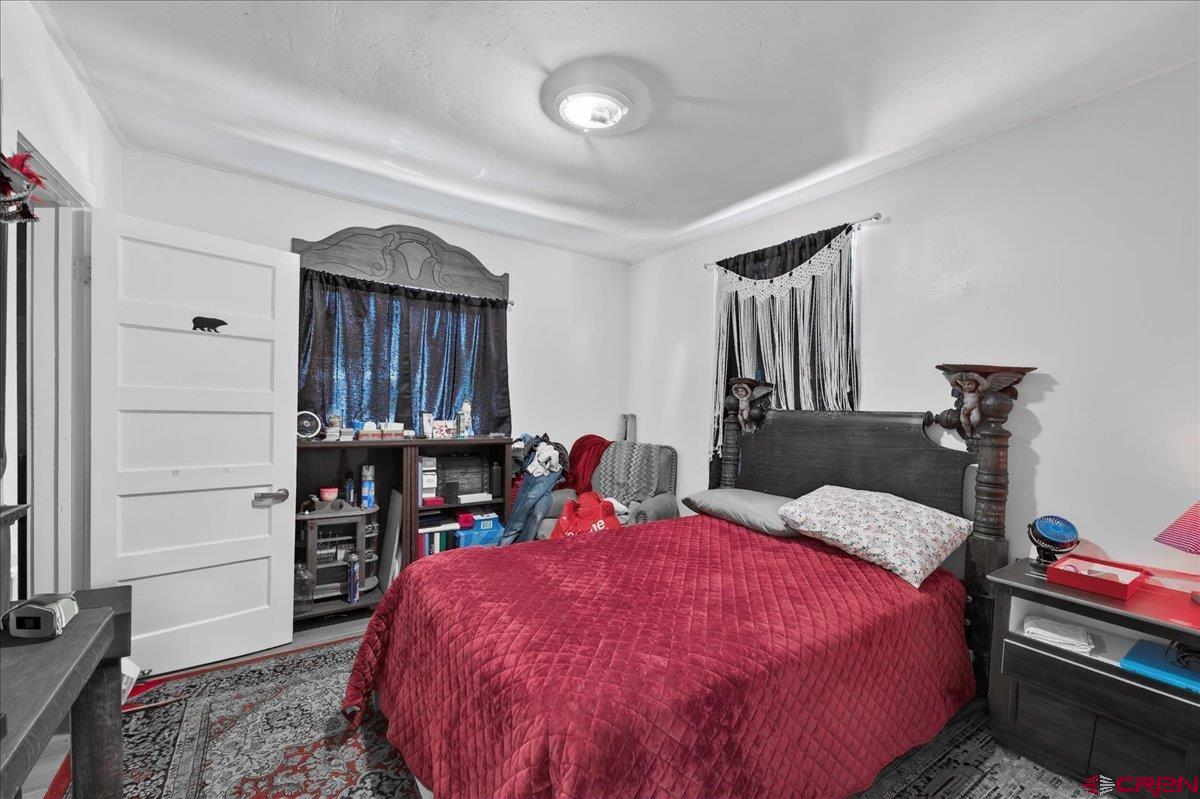 2091 Locust Road Montrose, CO 81401 - Photo 11 of 45 a bed room with a bed and a closet