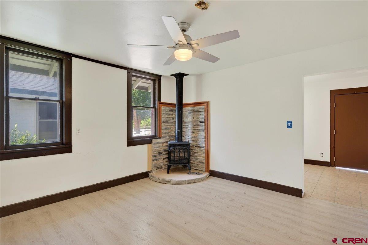 2091 Locust Road Montrose, CO 81401 - Photo 12 of 45 wooden floor in an empty room with a window