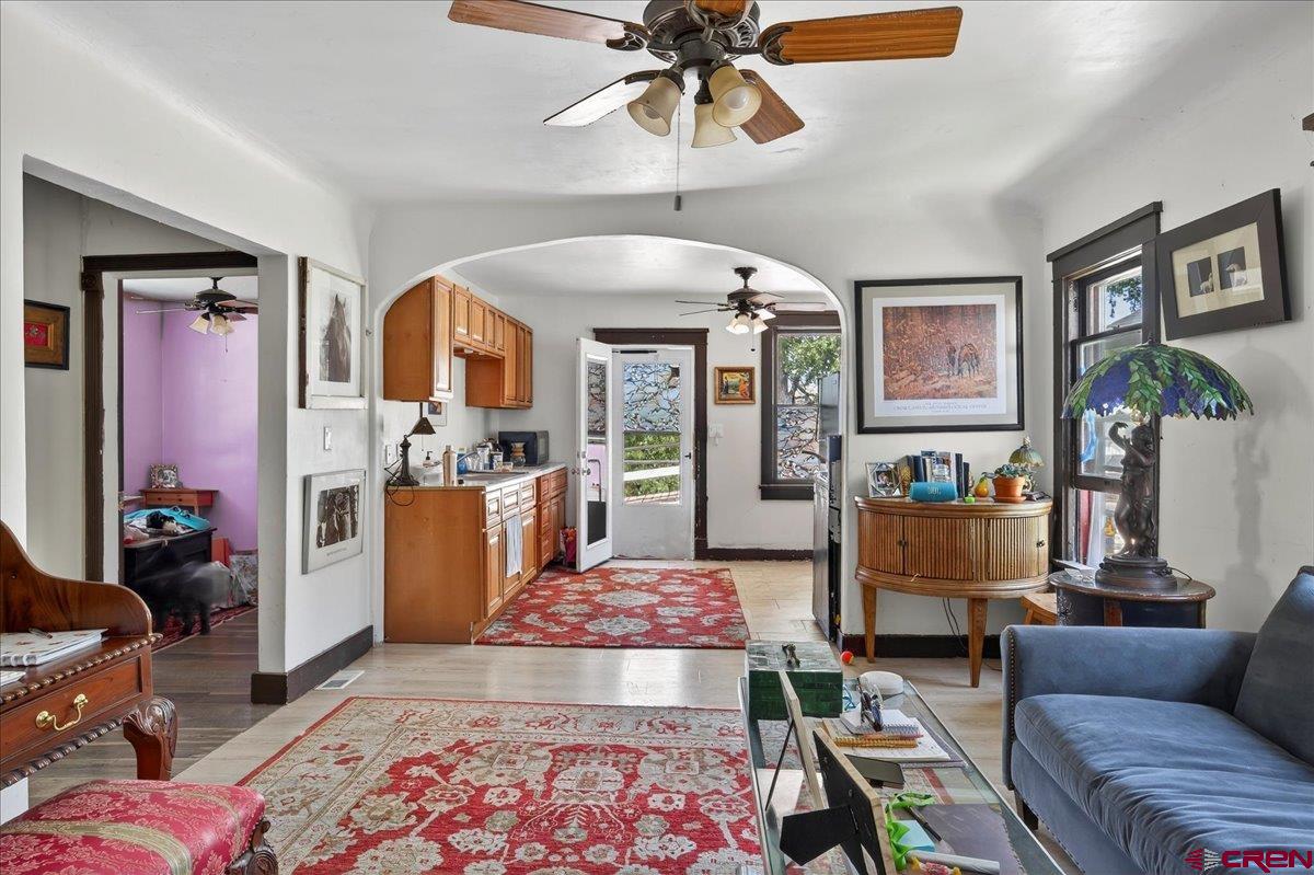 2091 Locust Road Montrose, CO 81401 - Photo 21 of 45 a living room with furniture and a rug