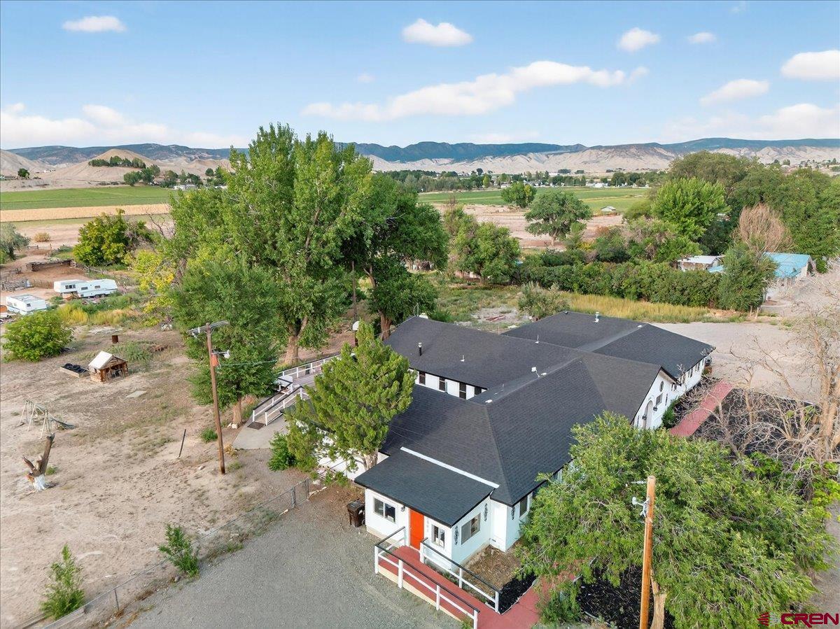 2091 Locust Road Montrose, CO 81401 - Photo 44 of 45 an aerial view of a city with lots of residential buildings ocean and mountain view in back