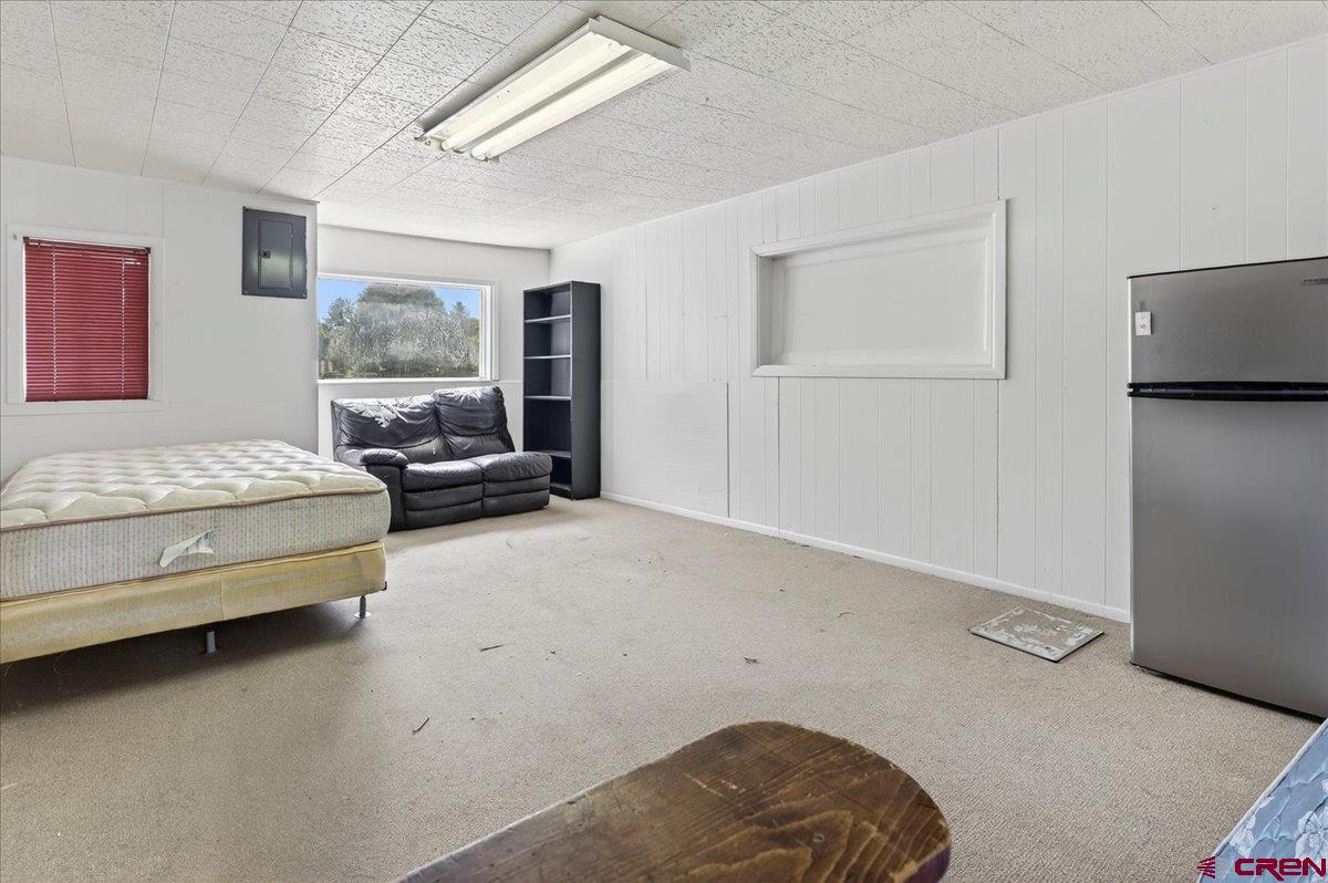 2091 Locust Road Montrose, CO 81401 - Photo 6 of 45 a bedroom with a bed and wooden floor